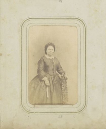 Portrait of a woman with a cap and a long skirt
