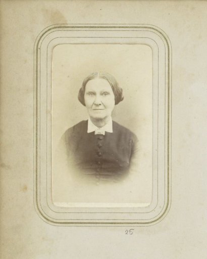 Portrait of a woman with a necklace and updo hair