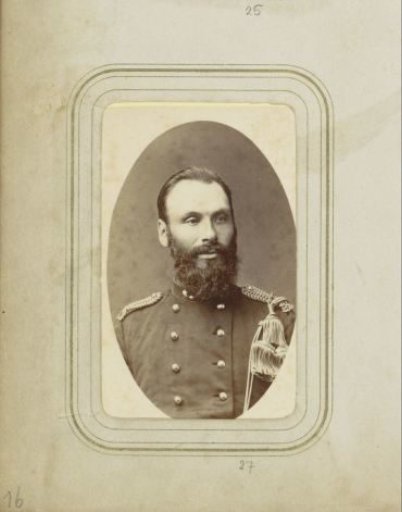 Portrait of a man with a beard in military costume