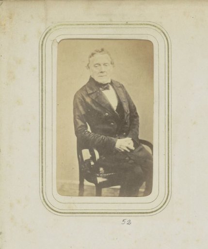 Portrait of a man in a coat with a bow tie