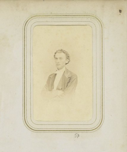 Portrait of a man with wavy hair in a coat