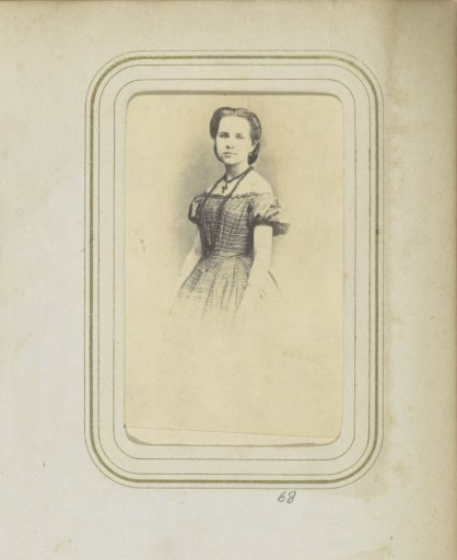 Portrait of a Woman in a Striped Dress with a Necklace and a Cross