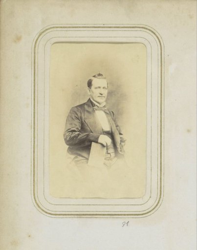 Portrait of a Seated Man in a Coat with a Book