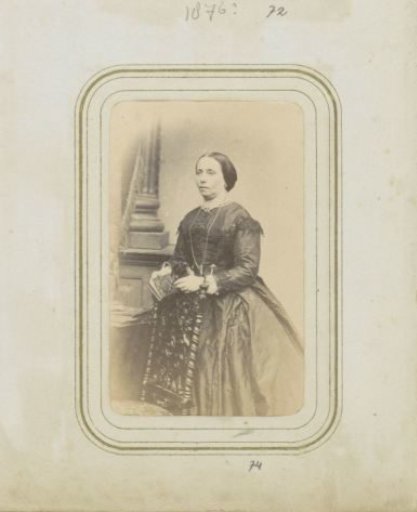 Portrait of a woman with a book, wearing a long dress