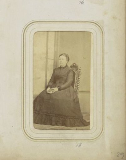 Portrait of a woman in a dress with a book in her hands