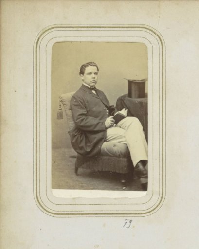Portrait of a young man with a book in his hands
