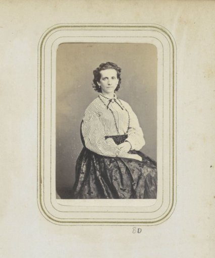 Portrait of a woman in a skirt and a striped blouse