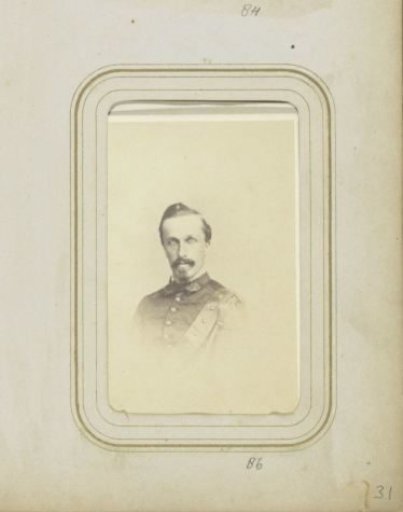 Portrait of a man with a moustache and beard in military costume