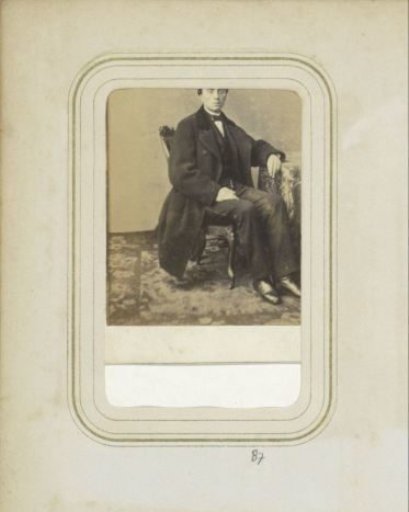 Portrait of a man in a long coat
