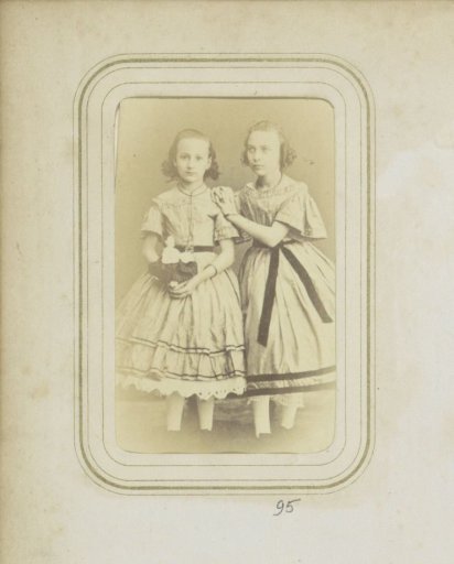 Portrait of two girls in dresses
