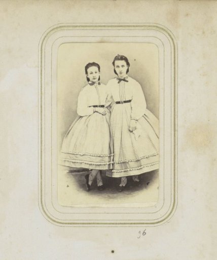 Portrait of two girls in wide skirts and blouses