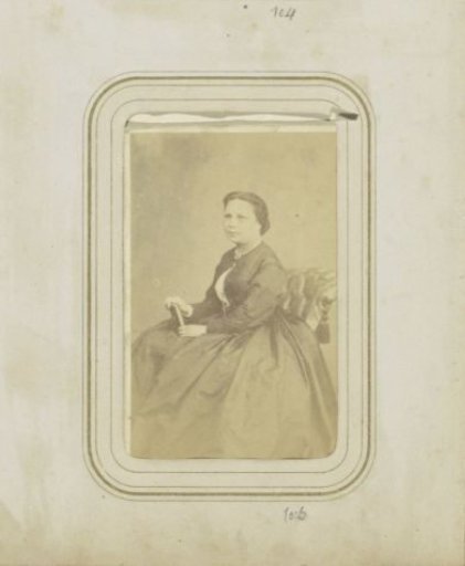 Portrait of a woman in a wide dress holding a book