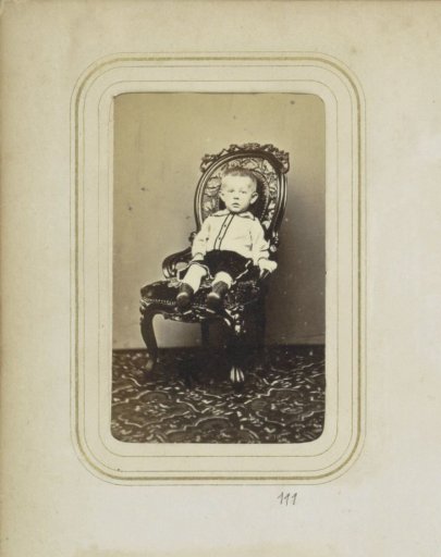 Portrait of a boy in a chair