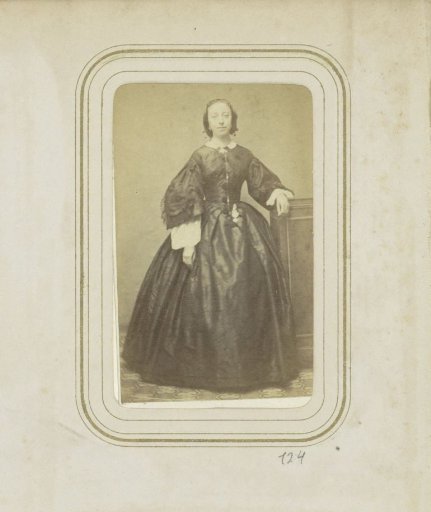 Portrait of a woman in a long dress with wide sleeves