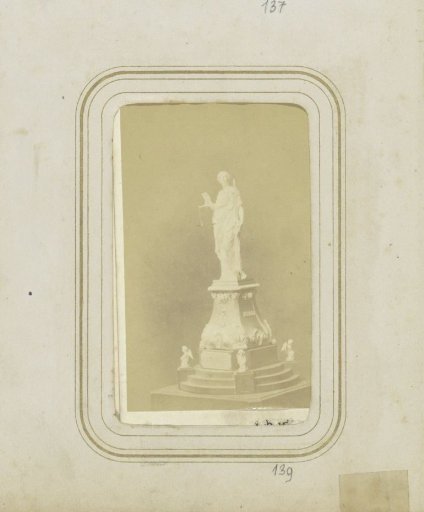 Monument in silver depicting Lady Justice on a pedestal surrounded by angels