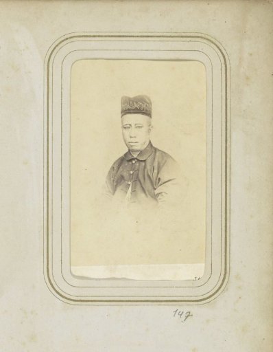 Portrait of a man in a coat with a head covering