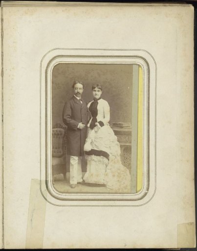 Portrait of a man with a long coat and a woman in a dress