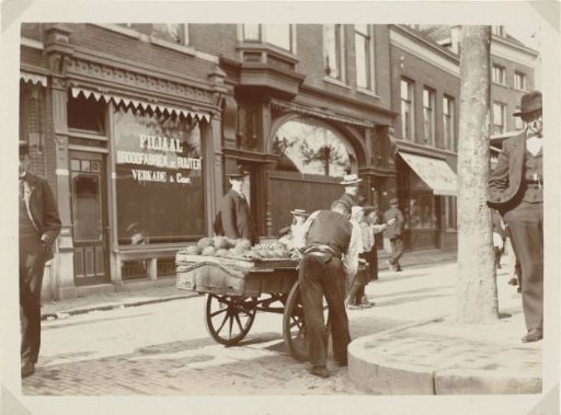 Merchant with a hand cart in an unknown city