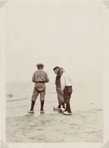 Three boys on the beach at Scheveningen