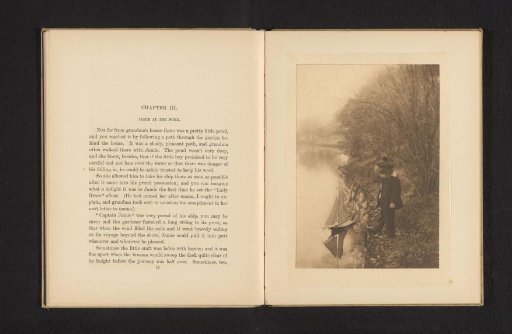 Boy by a pond with a small boat