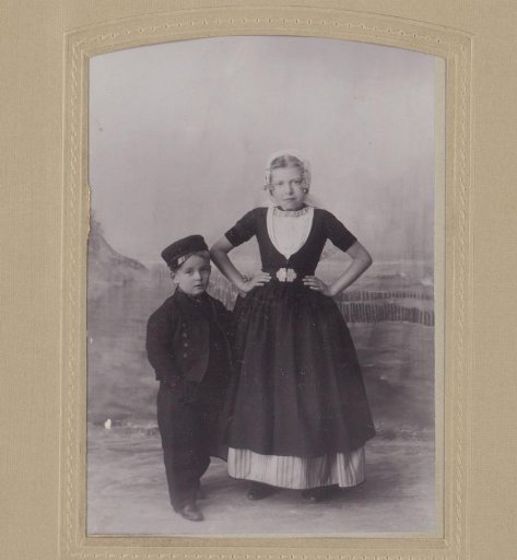 Studio portrait of a boy and girl in Zeelandic traditional dress