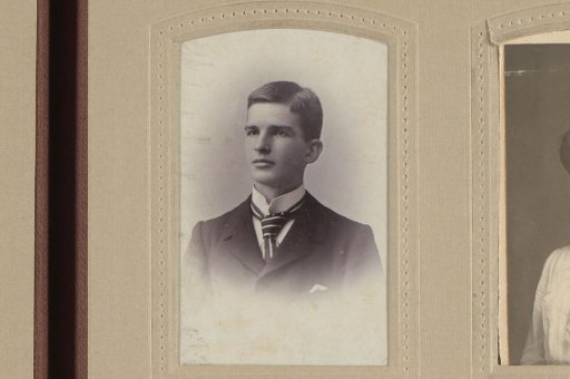 Studio portrait of a young man in a suit with a necktie