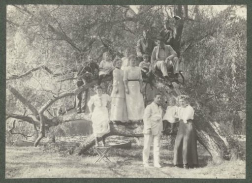 Group portrait of the Kessler family by a fallen tree