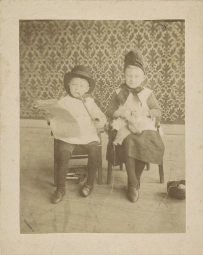 Two children dressed as adults