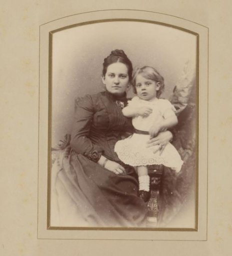 Studio portrait of mother and daughter