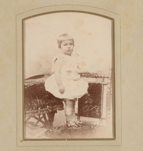 Portrait of An Kessler on a chair at approximately 2 years of age