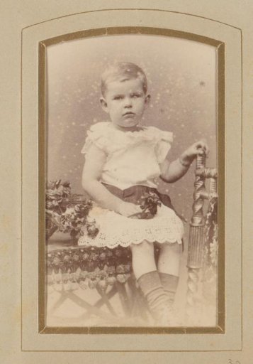 Studio portrait of Margo Kessler in her youth wearing a white dress