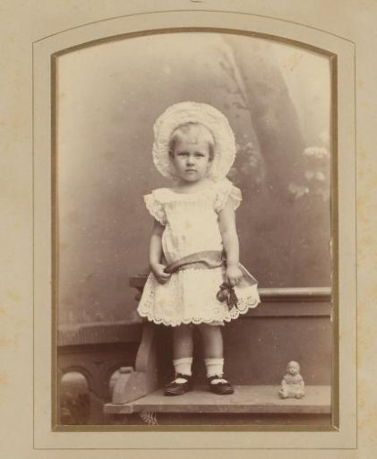 Portrait of An Kessler on a bench at approximately 3 years of age