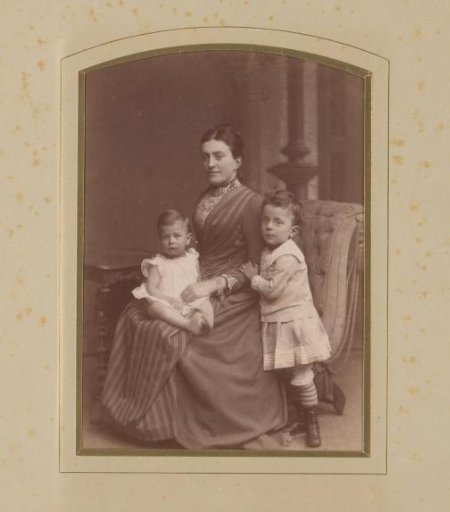 Studio portrait of a woman and two children