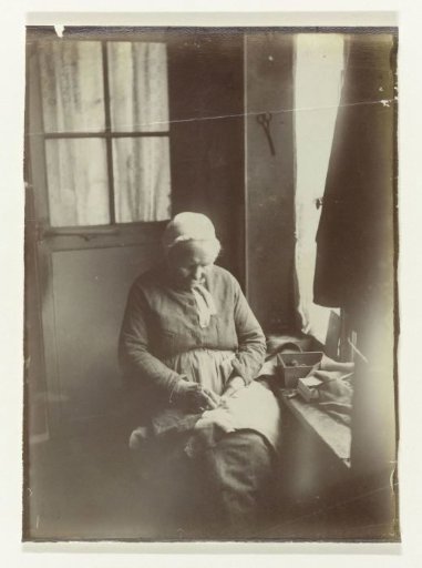 Old Woman Sewing by a Window