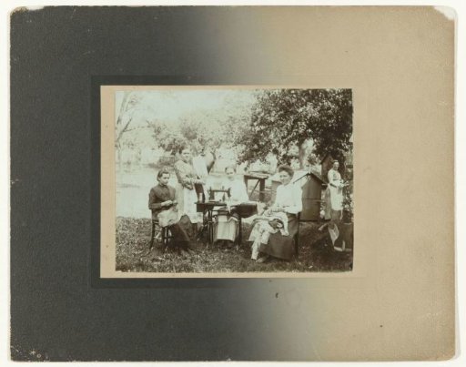 Group portrait of unknown women with sewing machines
