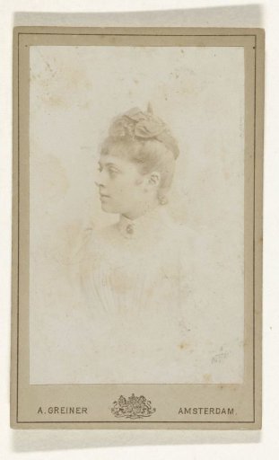 Studio Portrait of a Young Woman in a White Dress