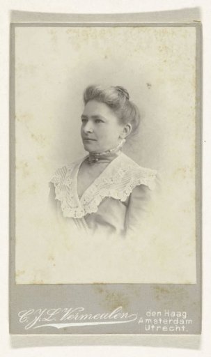 Studio Portrait of a Woman in a High-Closed Dress Trimmed with a Lace Collar