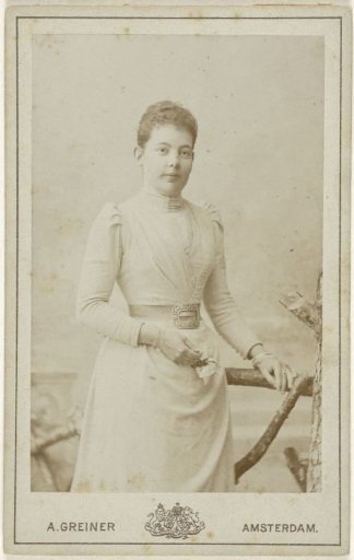 Studio Portrait of a Young Woman in a High-Closed Dress with Puffed Sleeves