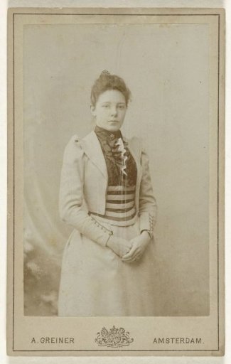 Studio Portrait of a Woman in a Skirt and a Jacket with Puffed Sleeves