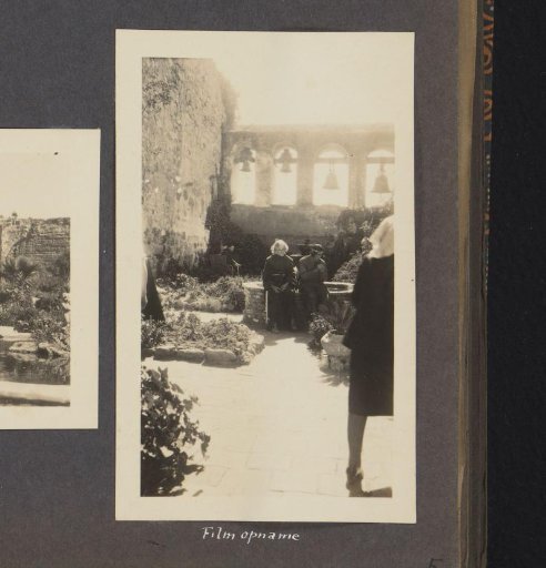 Three people in the courtyard of Mission San Juan Capistrano
