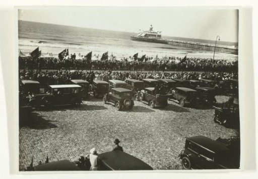 Cars and People on the Boulevard of Scheveningen, Looking at a Procession of Horsemen with Flags