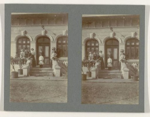 Family portrait in front of a house