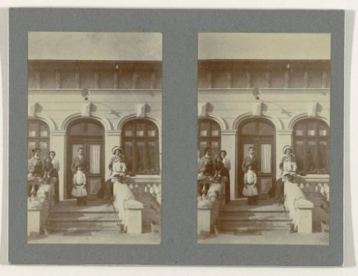 Family portrait at the door of a house