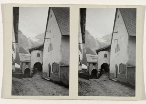 Tyrolean house with a view through to a snow-covered mountain landscape