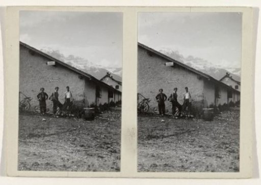 Three people at sleeping quarters for walkers in a mountain landscape