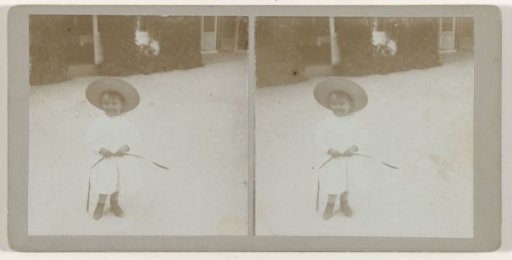 Portrait of a young boy in white clothing with a hat