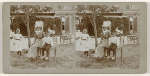 Portrait of a Woman and Two Children at an Outdoor Table