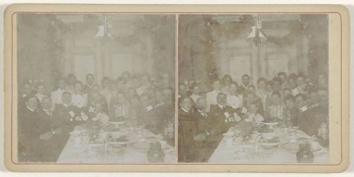 Group portrait including the Kessler family at a richly set table