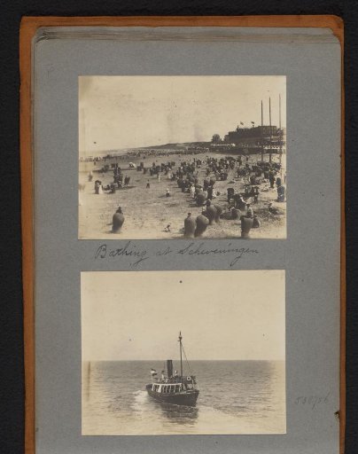 View of the beach in Scheveningen with people in deck chairs and a steamboat launching