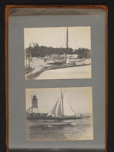 Woman Standing on a Moored Sailing Boat and View of a Lighthouse with Pier and Sailing Boats in Front